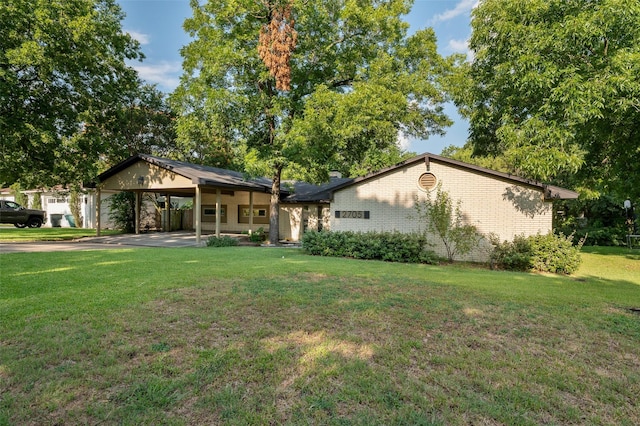 ranch-style house with a carport and a front yard