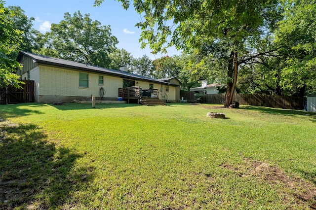 view of yard featuring an outdoor fire pit