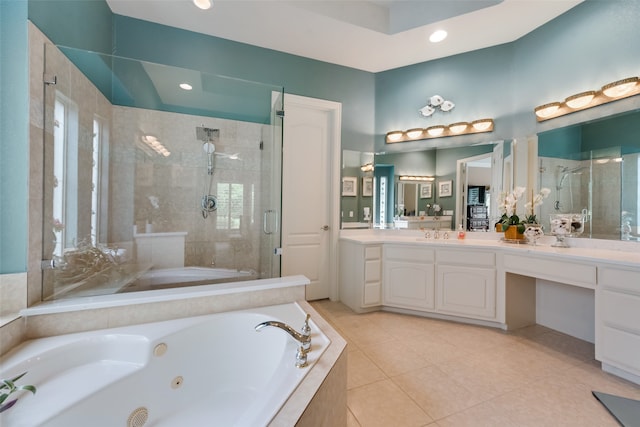 bathroom featuring separate shower and tub, tile patterned flooring, and vanity