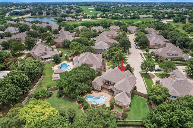 drone / aerial view with a water view