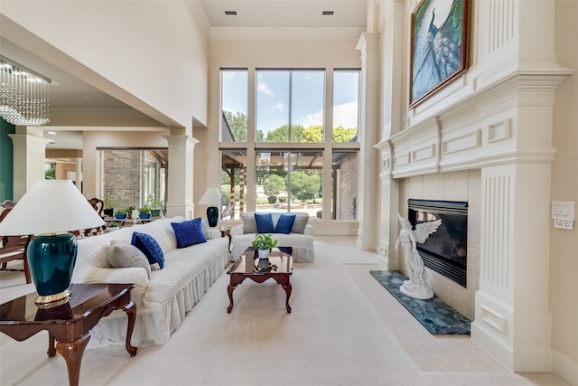 carpeted living room with a high end fireplace and ornamental molding