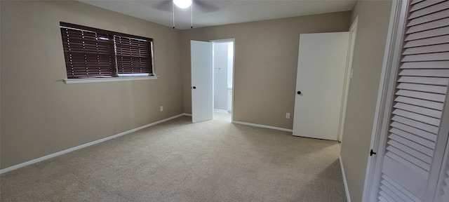 unfurnished bedroom with carpet and ceiling fan