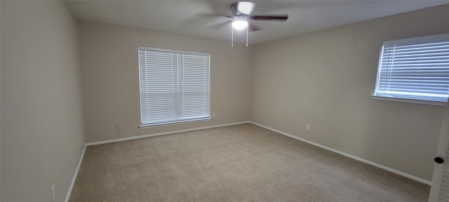 carpeted empty room with ceiling fan