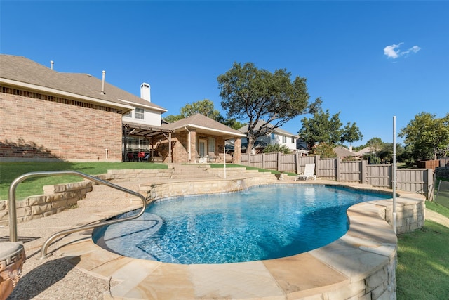 view of swimming pool with a patio area