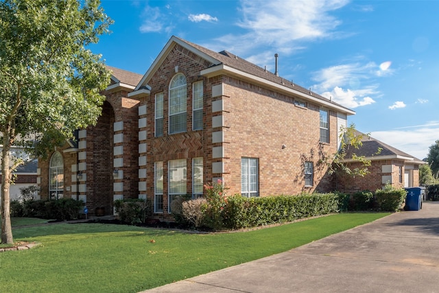 view of home's exterior with a lawn