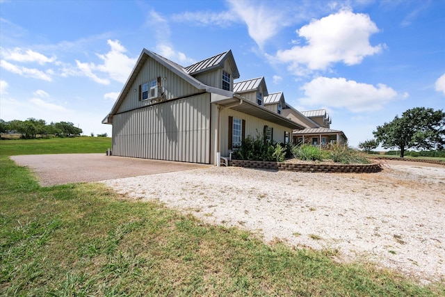 view of property exterior with a lawn