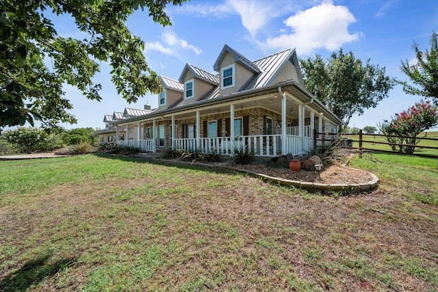 view of front facade featuring covered porch and a front lawn