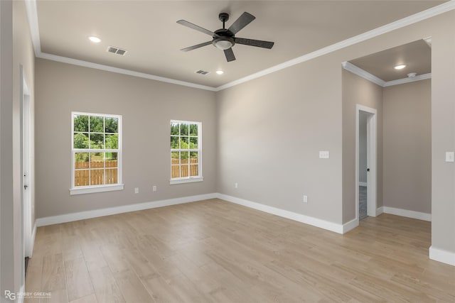 spare room with light hardwood / wood-style flooring, ceiling fan, and crown molding