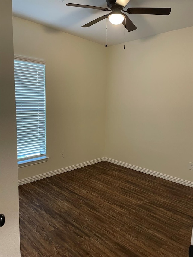 unfurnished room featuring dark hardwood / wood-style floors and ceiling fan