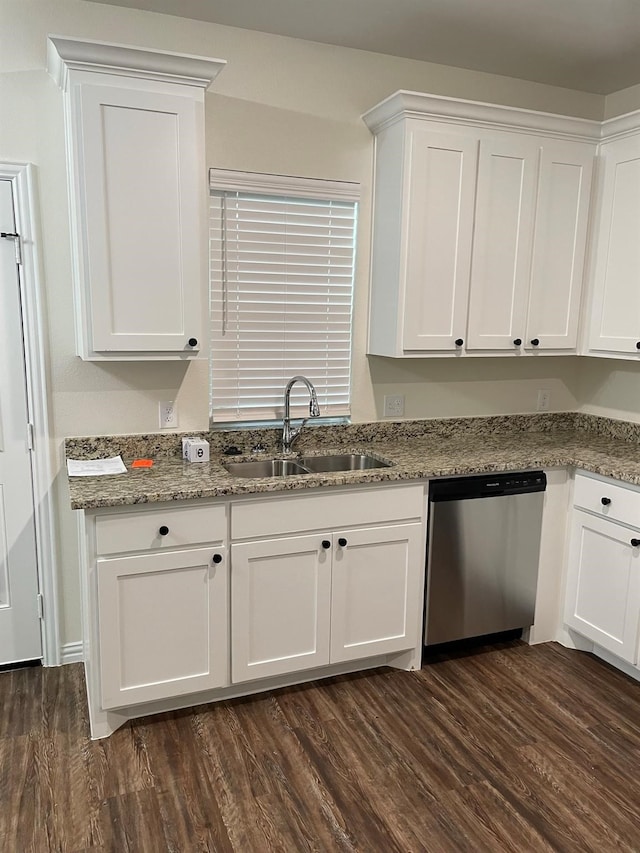 kitchen with white cabinets, light stone counters, stainless steel dishwasher, dark hardwood / wood-style floors, and sink