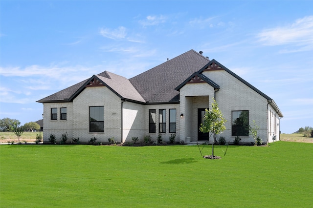 view of front of home with a front yard