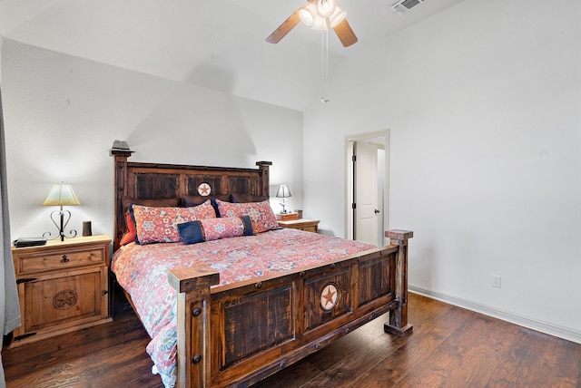 bedroom featuring ceiling fan, dark hardwood / wood-style flooring, and lofted ceiling