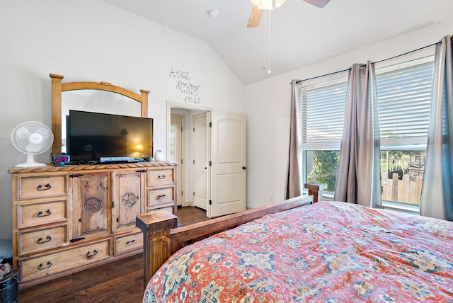 bedroom with ceiling fan, dark hardwood / wood-style flooring, and vaulted ceiling