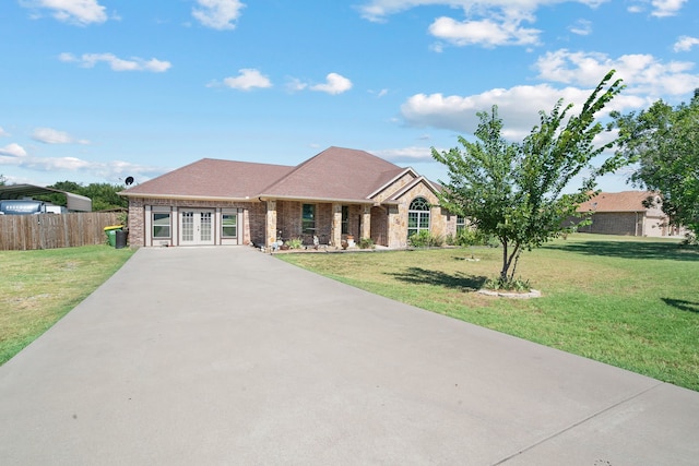 ranch-style house featuring a front lawn