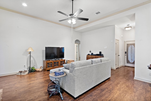 living room featuring ceiling fan, dark hardwood / wood-style floors, and ornamental molding