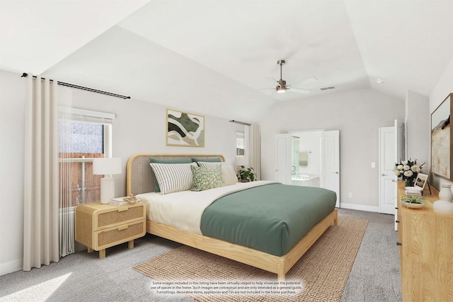 carpeted bedroom featuring vaulted ceiling, ceiling fan, and ensuite bath