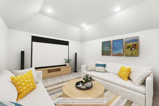 carpeted home theater room featuring vaulted ceiling