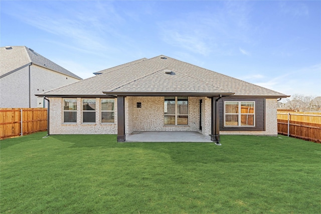 back of property featuring a patio and a lawn