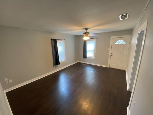 foyer with ceiling fan and wood-type flooring