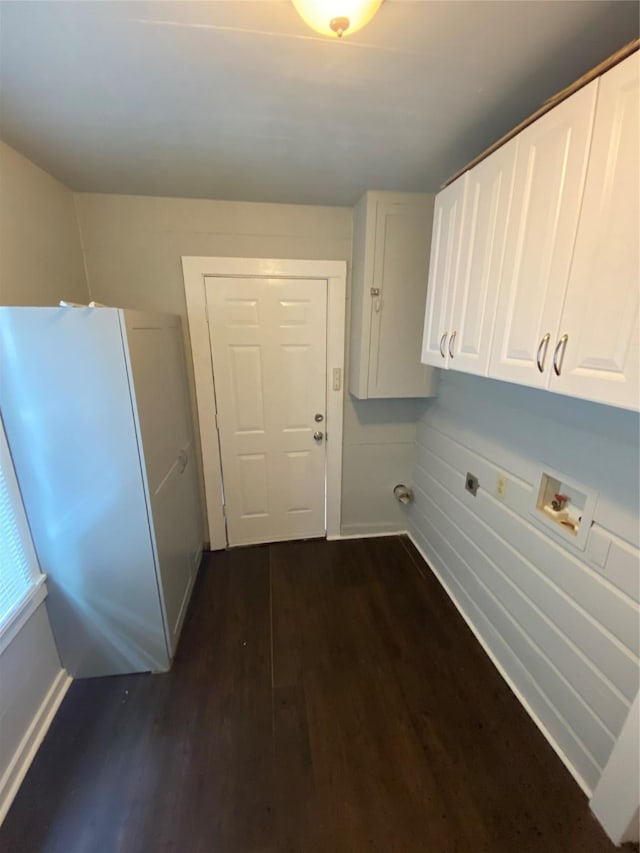 laundry room featuring washer hookup, cabinets, and dark hardwood / wood-style floors