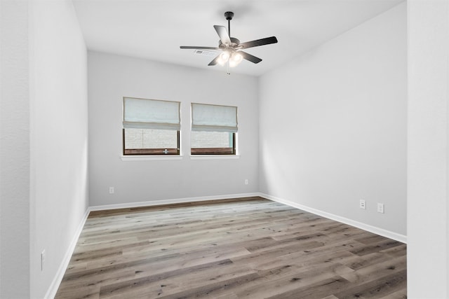 kitchen with tasteful backsplash, dishwashing machine, white cabinets, gas stovetop, and light hardwood / wood-style flooring