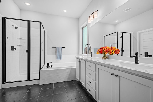 bathroom featuring tile patterned flooring, vanity, and independent shower and bath