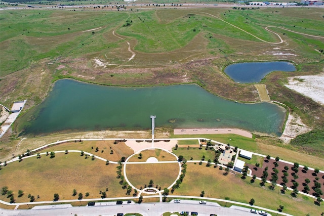 drone / aerial view featuring a rural view and a water view