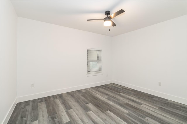 unfurnished room featuring dark hardwood / wood-style floors and ceiling fan