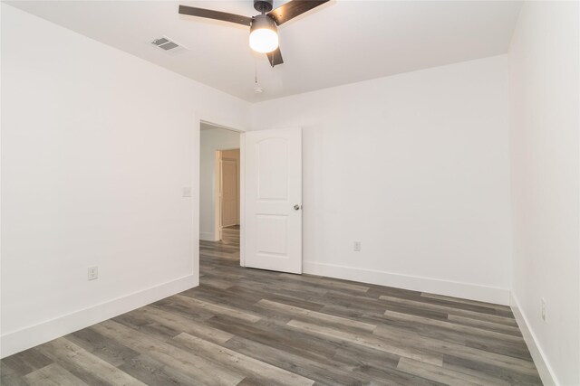 bathroom featuring vanity, a tile shower, and toilet