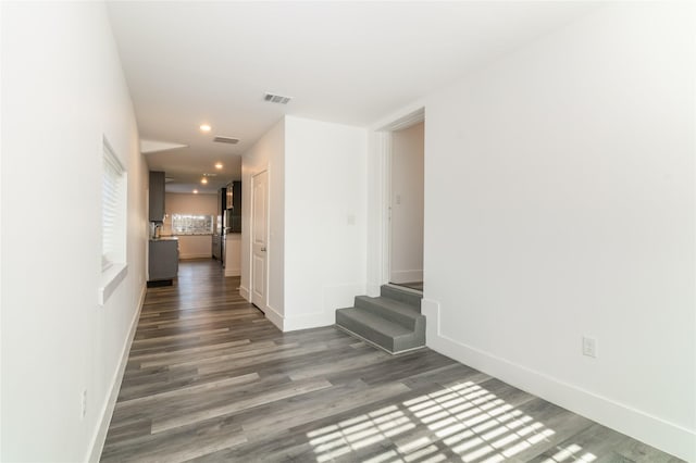 942 County Road 2240, Corsicana, TX 75109 - hallway with wood finished floors, stairs, recessed lighting, and baseboards