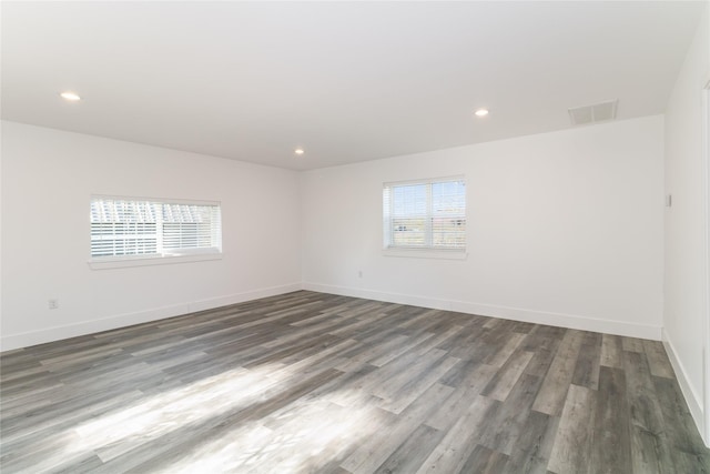 spare room featuring dark hardwood / wood-style floors