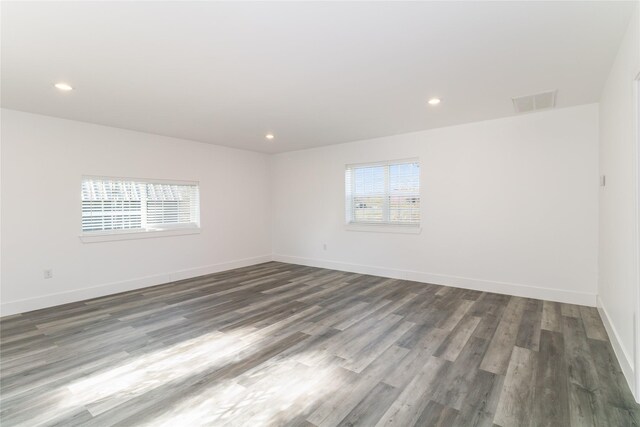 942 County Road 2240, Corsicana, TX 75109 - unfurnished room with healthy amount of natural light, wood finished floors, baseboards, and recessed lighting