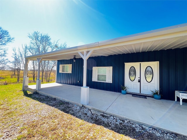 942 County Road 2240, Corsicana, TX 75109 - view of exterior entry with board and batten siding and a porch