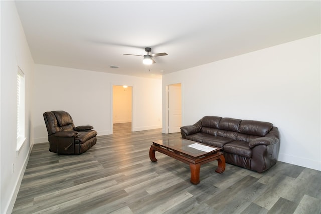 942 County Road 2240, Corsicana, TX 75109 - living room featuring wood finished floors, a ceiling fan, and baseboards