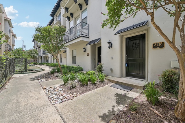 property entrance with a balcony