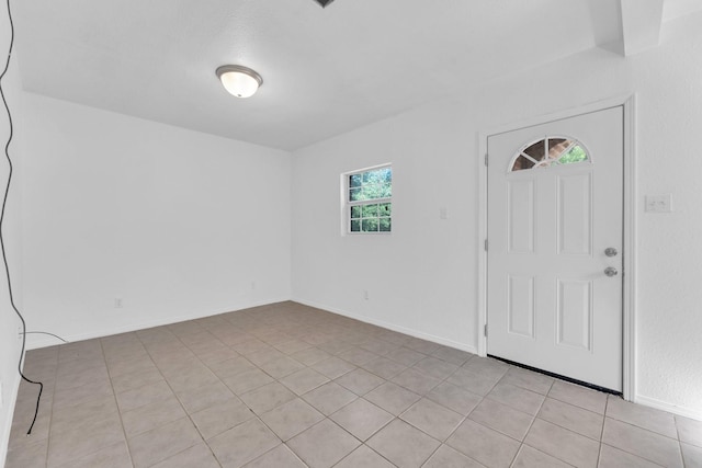 entrance foyer with light tile patterned flooring