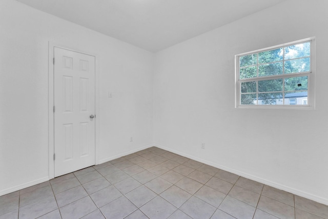 empty room featuring light tile patterned floors