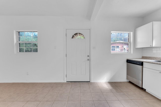 tiled entrance foyer with beamed ceiling