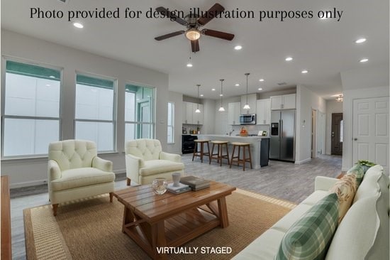 living room with hardwood / wood-style floors and ceiling fan