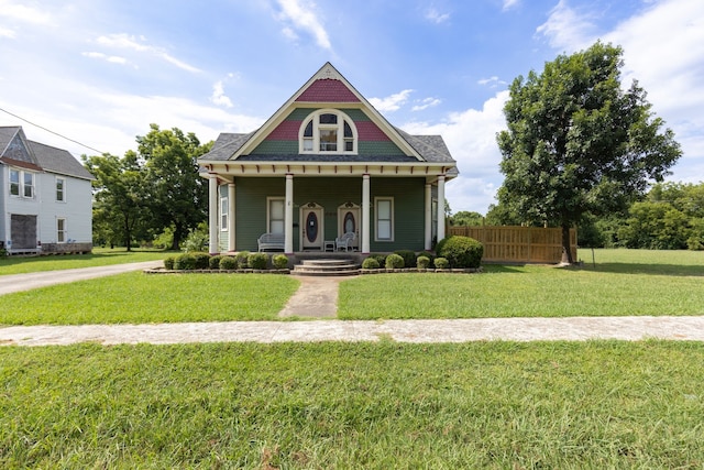 view of front of house featuring a front yard and covered porch