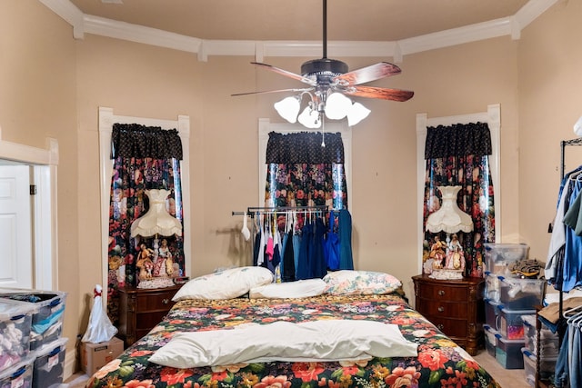 bedroom featuring ceiling fan and crown molding