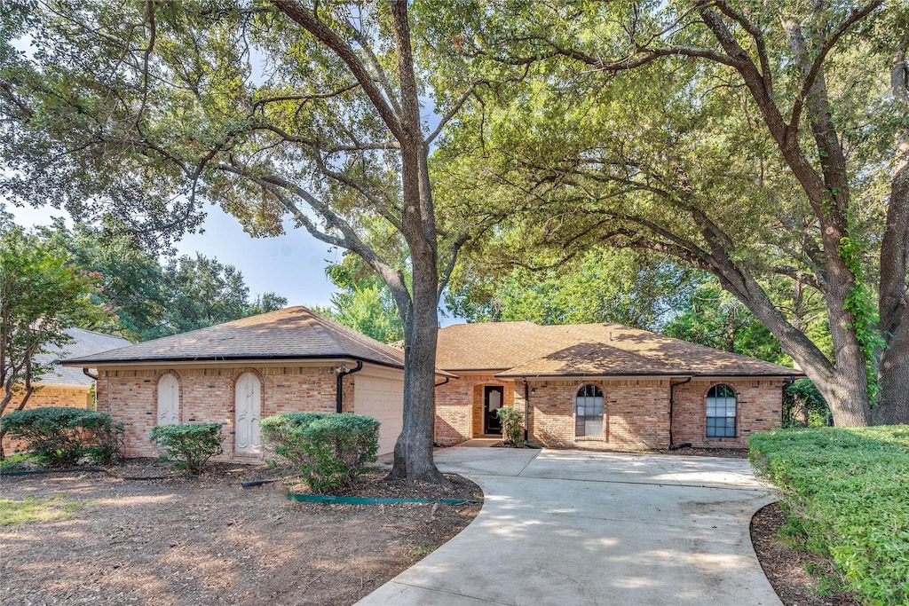 ranch-style home featuring a garage