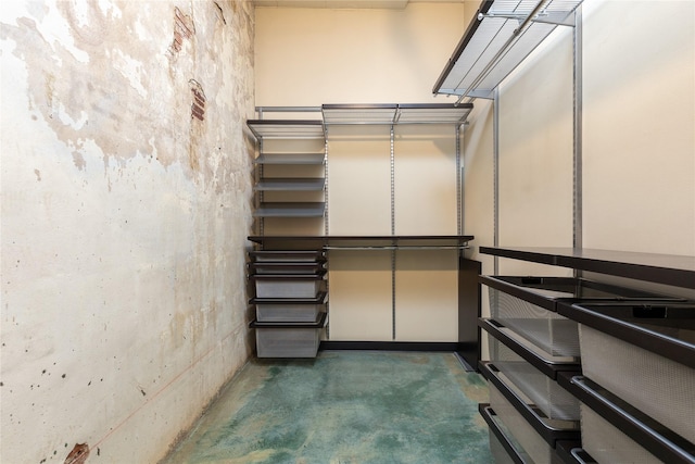 walk in closet featuring a high ceiling