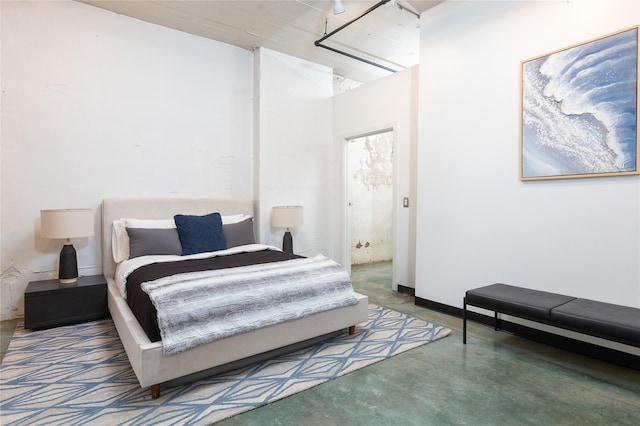 bedroom with concrete flooring