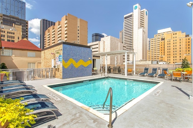 view of pool featuring a patio area and a pergola