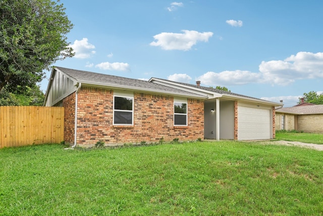 single story home featuring a front lawn and a garage