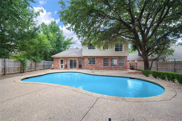 view of swimming pool with a patio area