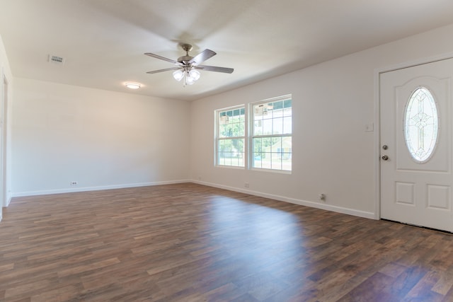 foyer entrance with ceiling fan and dark hardwood / wood-style flooring