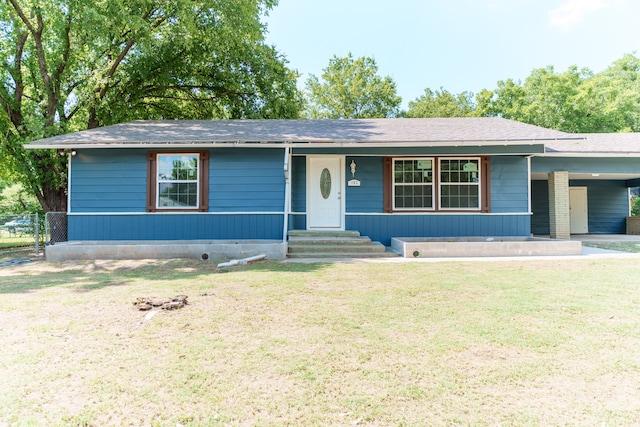 ranch-style home featuring a front yard