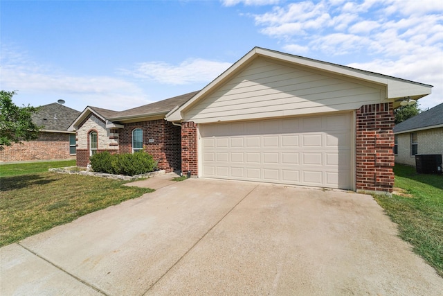 ranch-style home with a front yard, a garage, and central AC